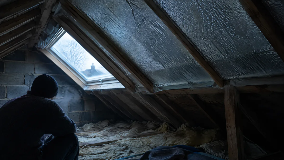 A cold loft interior with condensation forming on the roof underside