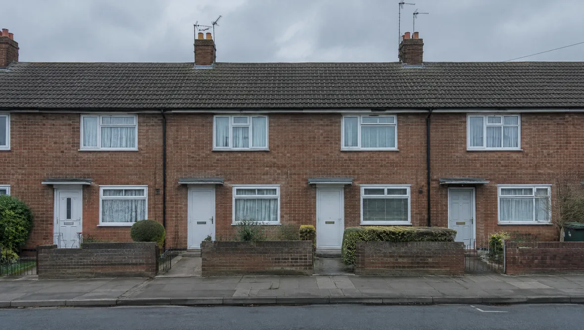 A row of similar British rental properties on one street
