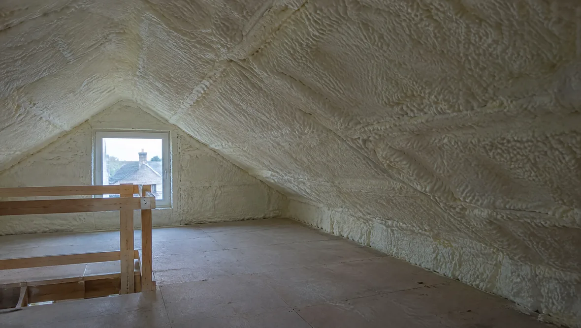 A loft roof slope sealed with spray foam, no ventilation visible