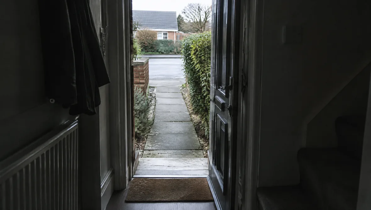 A front doorstep of a British house seen from inside the hall